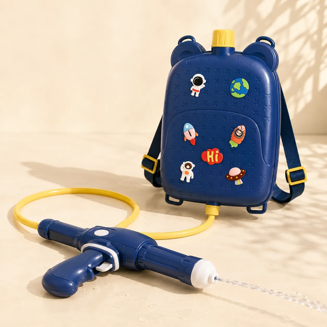 A backpack tank water gun with hose and lance on a cream ground